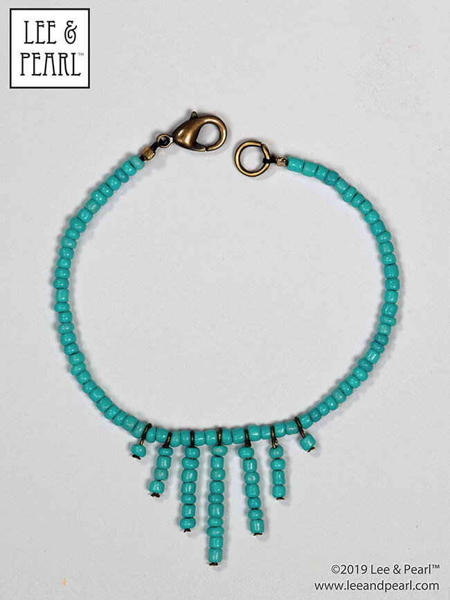 With the techniques and tools we feature in the Lee & Pearl Introduction to Jewelry Making for Vinyl Play Dolls eBook, when you see a style that you like, you can recreate it yourself. Follow along as we show you how we turned a Pinterest inspiration image into this turquoise sunburst choker for 18 inch American Girl® and other dolls!