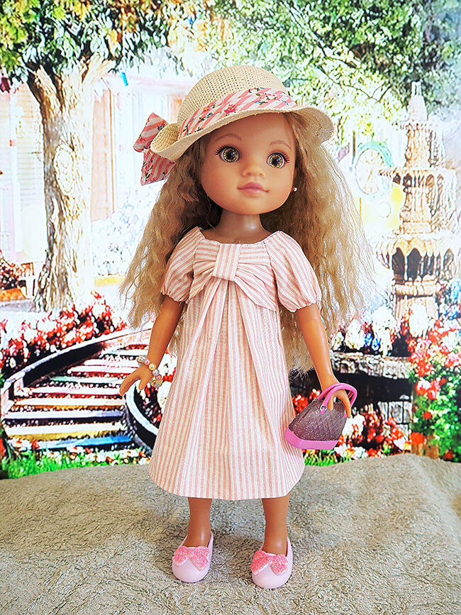 Our FREE GIFT to Lee & Pearl mailing list subscribers — Pattern 1038: The Gift Bow Front Dress for 18 Inch American Girl, 16 Inch A Girl for All Time and 14 1/2 Inch Wellie Wisher and similar dolls. Click to sign up! Here's  Hearts 4 Hearts® Lauryce wearing a 14 1/2 inch pattern size dress made by Linda L.