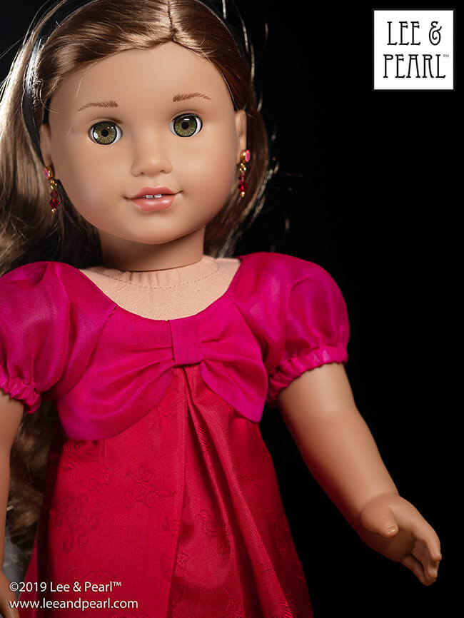 We made our American Girl doll’s jewel-toned dress using silk organza and figured China silk from our COMING SOON silk fabric kits, and Lee & Pearl Pattern 1038: The Gift Bow Front Dress for 18 Inch, 16 Inch and 14 1/2 Inch Dolls. This pattern is our FREE gift to Lee & Pearl mailing list subscribers in 2019. Get your own copy of this lovely pattern — sign up today!