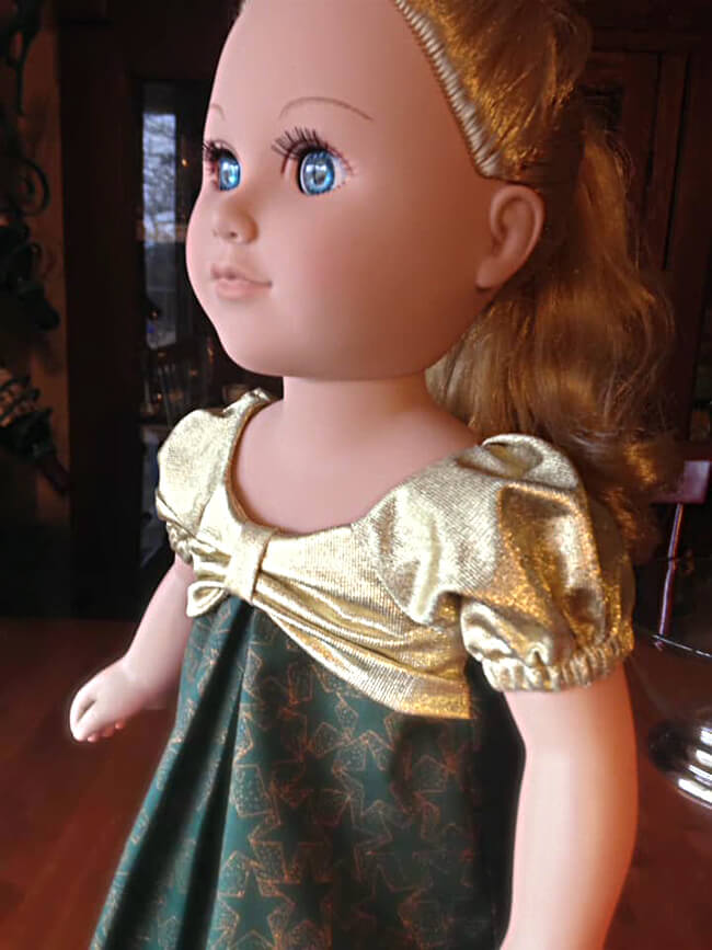 Our FREE GIFT to Lee & Pearl mailing list subscribers — Pattern 1038: The Gift Bow Front Dress for 18 Inch American Girl, 16 Inch A Girl for All Time and 14 1/2 Inch Wellie Wisher and similar dolls. Click to sign up! Here's Helen M.W.'s My Life As® doll, wearing a holiday print dress with sparkly gold lamé bow and sleeves.