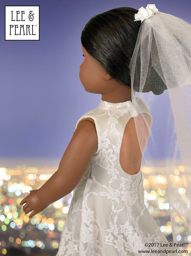 It's her day! Our American Girl doll makes a stunning bride wearing a stretch lace gown, made using Lee & Pearl Pattern 1055: Skating Dresses for 18 Inch Dolls, with additional flowing skirt pieces available as a FREE Tweak-the-Pattern newsletter feature.