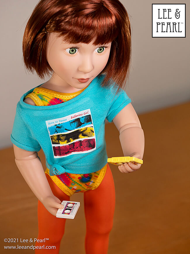 Introducing Pattern 1983: She's a Maniac Off-One-Shoulder Workout T-Shirt for Dolls! We're proud to present this brand new ‘80s / aerobics / workout and dance-inspired pattern for 18 inch American Girl®, 16 inch A Girl for All Time® and 14 ½ inch WellieWishers™ and similar dolls, now available in the Lee & Pearl Etsy store.