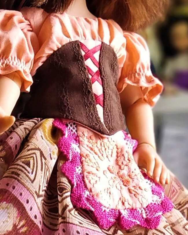 Look who's making Lee & Pearl Pattern 1078: Village Dance Peasant Style Ballet Bodice and Detachable Apron for Dolls! Within days of the pattern release, we received a glowing review that included the most wonderful photos of a doll we’d never seen before wearing the bodice with a peasant-style version of our Pattern 1072: Corps de Ballet Romantic Tutu, as well. CLICK THROUGH for more details!