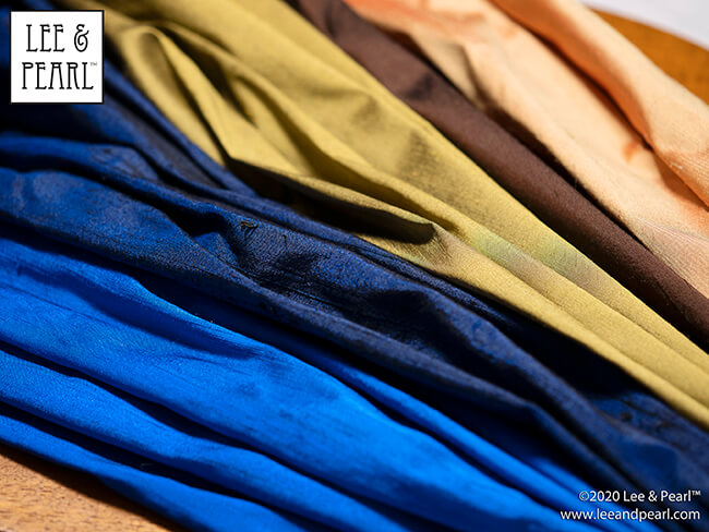 Treat yourself to a surprise fabric gift this holiday season! We're calling our 2020 Lee & Pearl Mystery Bags the SILKEN LUXURY HOLIDAY edition because each bag will contain TWO half yard pieces of shimmering 100% silk dupioni or shantung taffeta, along with materials chosen from our velvets, velveteen, lamé, crinkle rayon, sateen, brocade, faux leather, sequin-studded jersey and anything else we can find that sparkles, rustles, shimmers or shines. Don't wait — once this edition is SOLD OUT, you'll have to wait for the next sale in 2021.