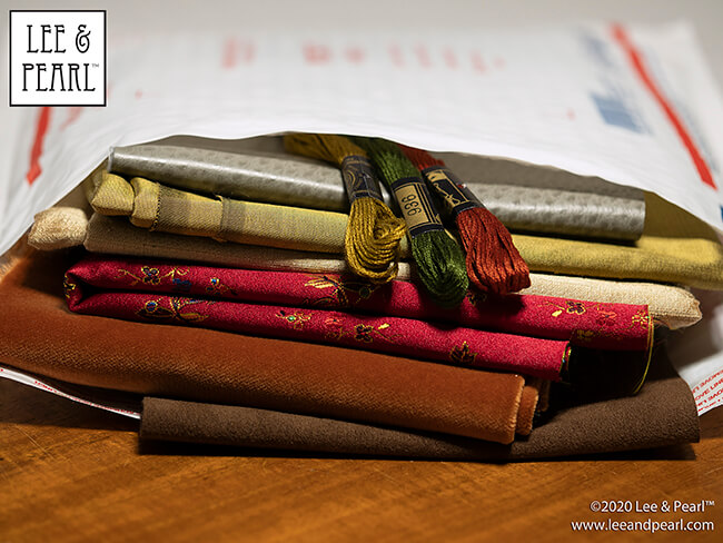 Treat yourself to a surprise fabric gift this holiday season! We're calling our 2020 Lee & Pearl Mystery Bags the SILKEN LUXURY HOLIDAY edition because each bag will contain TWO half yard pieces of shimmering 100% silk dupioni or shantung taffeta, along with materials chosen from our velvets, velveteen, lamé, crinkle rayon, sateen, brocade, faux leather, sequin-studded jersey and anything else we can find that sparkles, rustles, shimmers or shines. Don't wait — once this edition is SOLD OUT, you'll have to wait for the next sale in 2021.