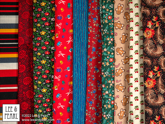 It's Mystery Bag Day! The 2022 Lee & Pearl Fabric Mystery Bags arrive in our Etsy store at 12 noon central on Friday, 12/02/22.
You've been so good all year and now you deserve something special. That's why we've tucked so many special things into each of our 2022 Lee & Pearl Fabric Mystery Bags.
Don't wait too long to check out and give yourself the gift of beautiful fabric. This year we have two special, limited edition Mystery Bags that also include BONUS PACK options, as well as our standard treat bags stuffed with beautiful fabrics for doll sewing!