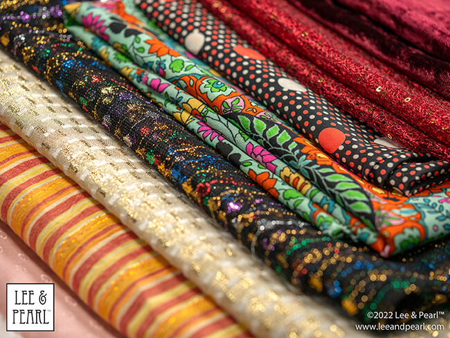 It's Mystery Bag Day! The 2022 Lee & Pearl Fabric Mystery Bags arrive in our Etsy store at 12 noon central on Friday, 12/02/22.
You've been so good all year and now you deserve something special. That's why we've tucked so many special things into each of our 2022 Lee & Pearl Fabric Mystery Bags.
Don't wait too long to check out and give yourself the gift of beautiful fabric. This year we have two special, limited edition Mystery Bags that also include BONUS PACK options, as well as our standard treat bags stuffed with beautiful fabrics for doll sewing!