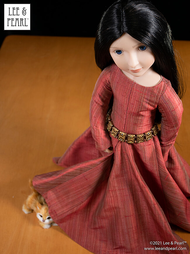 Welcome to Lee & Pearl Cyber Week — Day Three!
Today we have an exciting fabric release in our Etsy store: introducing lightweight 100% SILK SHANTUNG in a gorgeous, shimmering STRIÉ weave, perfect for all your holiday and heirloom doll sewing. We made a medieval gown for 16 inch dolls out of our piece of Cranberry Shimmer shantung. What will you make out of yours?