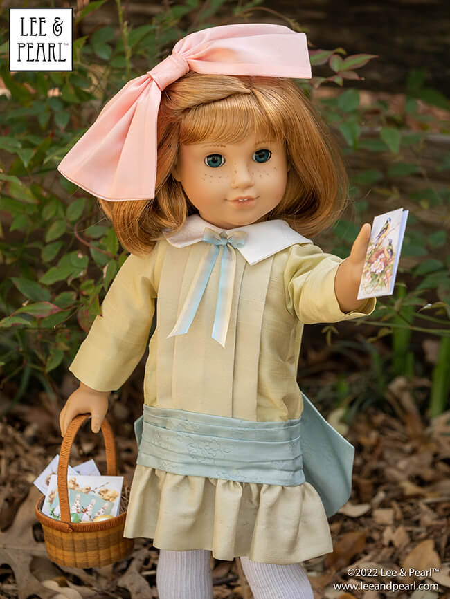 Happy Easter from Lee & Pearl! In this holiday pictorial, join our American Girl® doll Nellie as she explores a hidden garden, dressed in a lovely silk dress embellished with ribbons and bows, accompanied by seasonal props from our FREE tutorial and printable collection and the craft store floral and spring decor aisles.