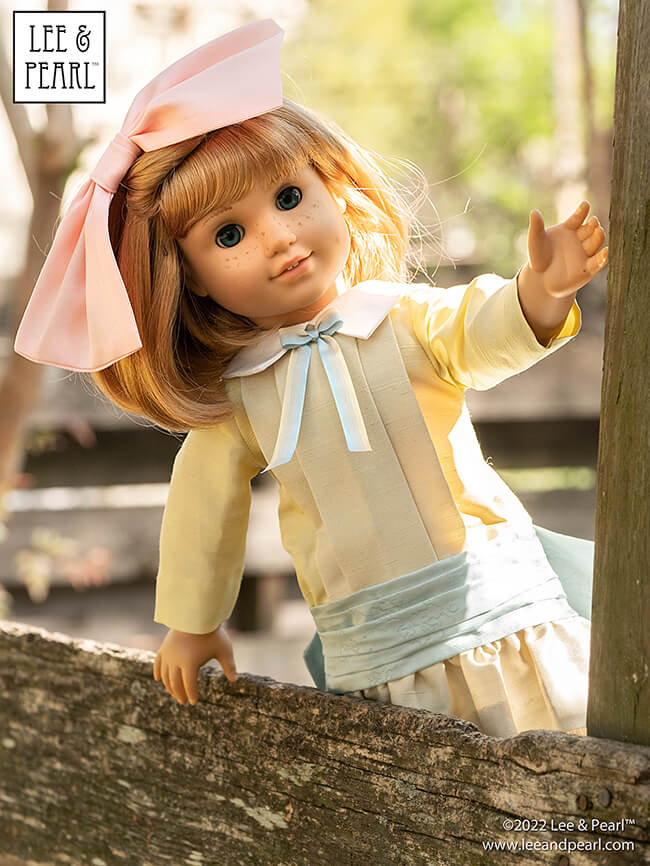 Happy Easter from Lee & Pearl! In this holiday pictorial, join our American Girl® doll Nellie as she explores a hidden garden, dressed in a lovely silk dress embellished with ribbons and bows, accompanied by seasonal props from our FREE tutorial and printable collection and the craft store floral and spring decor aisles.