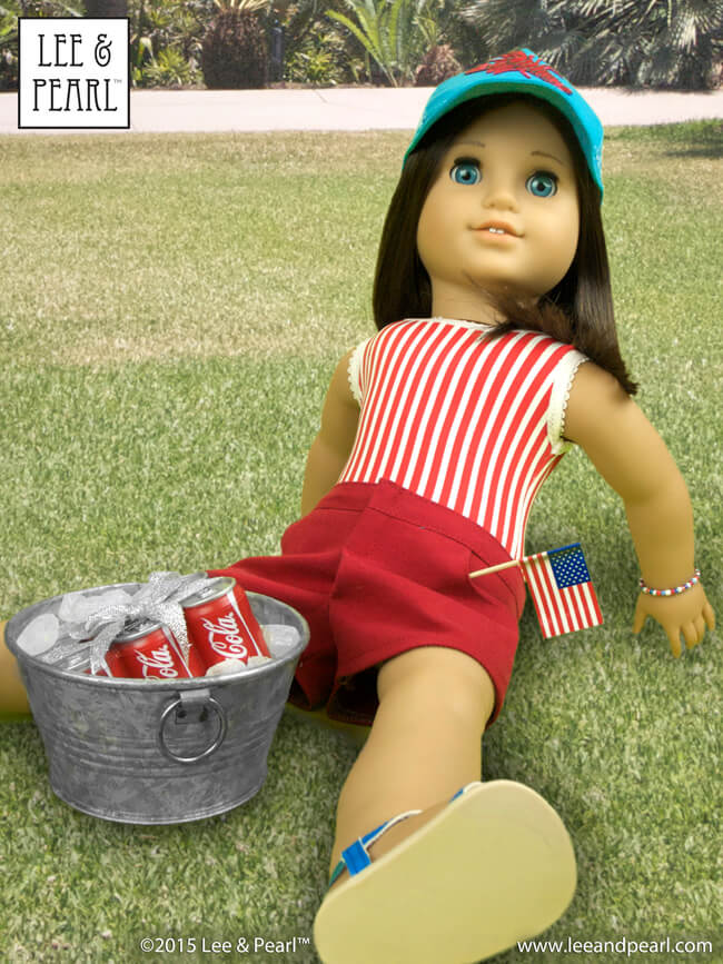 Happy July 4th! Our American Girl™ Chrissa wears a striped swimsuit, made using Lee & Pearl Pattern #1051: Ballet Basics Leotard & Unitard for 18" Dolls. Her red shorts are made using Lee & Pearl Pattern #1033: Bonjour, Paris Mini Wardrobe for 18" Dolls, and her picnic-ready cap comes from Lee & Pearl Pattern #1008: Classic Ball Cap and Big Fat Trucker Hat for 18" Dolls. Find these patterns in our Etsy store at https://www.etsy.com/shop/leeandpearl
